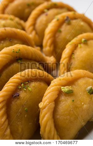 Gujiya - sweet dumplings made during the festival of holi and diwali, selective focus