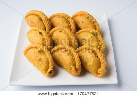 Gujiya - sweet dumplings made during the festival of holi and diwali, selective focus