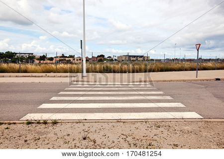 Pedestrian crossing in abandoned housing estate building site, Valencia region, Spain