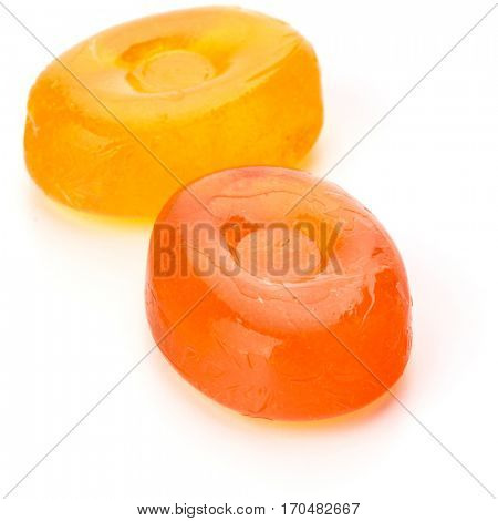 Two colorful fruit hard sugar candies,  boiled sweeties or sugar plums isolated on white background cutout