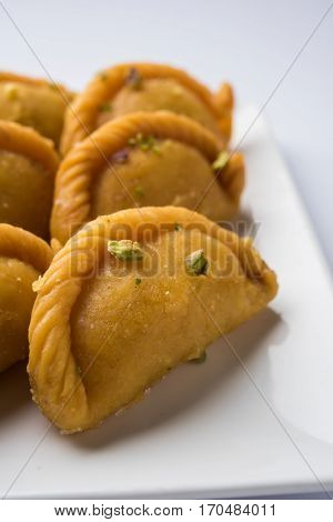 Gujiya - sweet dumplings made during the festival of holi and diwali, selective focus