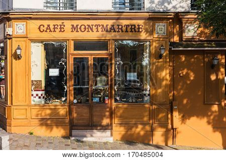 Paris France - July 06 2016: The charming Cafe Montmartre on Montmartre hill. Montmartre with traditional french cafes and art galleries is one of the most visited landmarks in Paris.