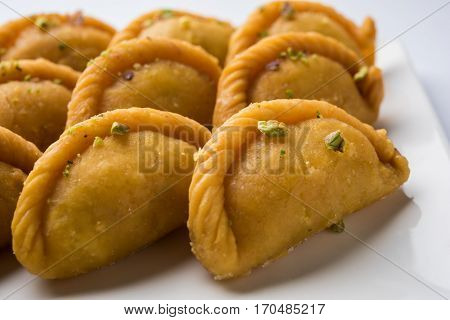 Gujiya - sweet dumplings made during the festival of holi and diwali, selective focus