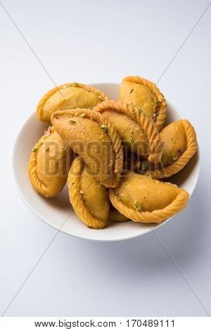 Gujiya - sweet dumplings made during the festival of holi and diwali, selective focus