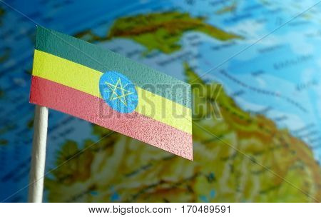 Ethiopian Flag With A Globe Map As A Background Macro