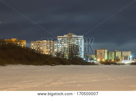 multi-storey building on the waterfront at night vologda russia