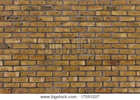 detalle de un muro de ladrillo amarillo clásico
