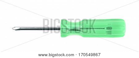 Tiny crosshead screwdriver with a plastic green handle, isolated over the white background