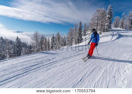 Large view on the skier in Alps mountains