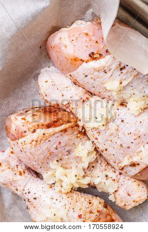 Fresh semifinished poultry with spices on wooden table