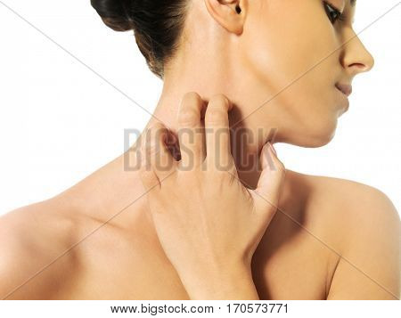 Topless woman scratching her neck