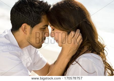 Portrait of a beautiful Hispanic couple laughing and smiling.