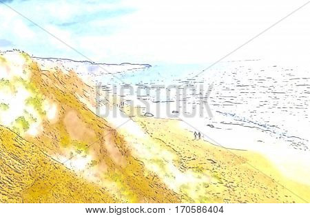 Happy couple walking along a sandy beach hand in hand.