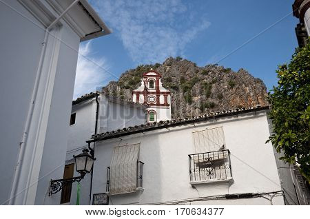 Traditional houses in Ubrique, Cadiz, with the San Antonio church at the background. This village is part of the pueblos blancos (white towns), in southern Spain, Andalusia region, and reminds the Arab past