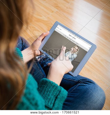 website frontpage against woman sitting on the floor while using her tablet