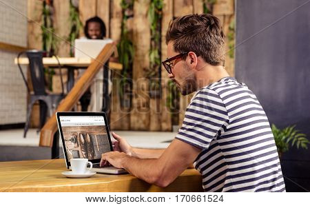 website frontpage against man using laptop