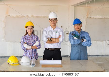 Team of engineers and technician Contractor or Constructor Standing in Building Construction site.