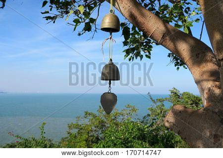 bell hanging at the tree beautiful sea view