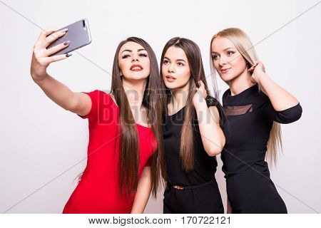 Three Models In Dresses Make Selfie.