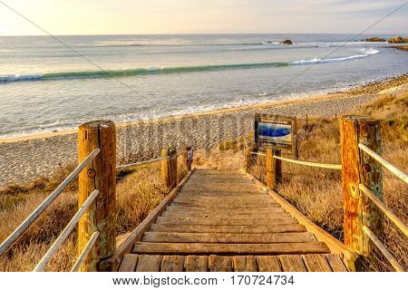 USA Pacific coast landscape, boardwalk to Leo Carrillo State Beach, Malibu, California.