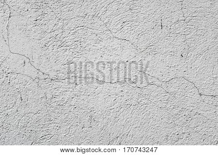 closeup of a rustic off-white plastered wall