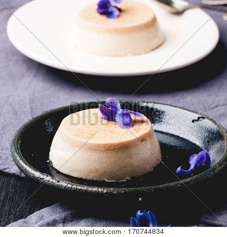 Caramel Pannacotta With Violet Flowers