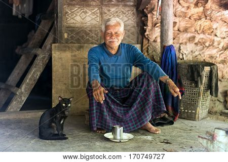 HPA-AN, MYANMAR - JANUARY 22, 2017 : A Karen tribe elderly man, 85 years old, is living alone in the forest in Hpa-An, Myanmar