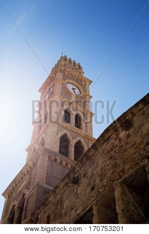Khan al-Umdan Clock Tower in Old City Acre Israel. Symbols of Islam ancient building
