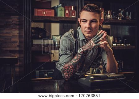 Professional hairstylist in barbershop interior