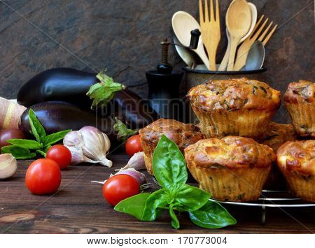Snack Savory Muffins Cakes With Eggplant, Tomatoes, Basil And Cheese On Wooden Background. Selective
