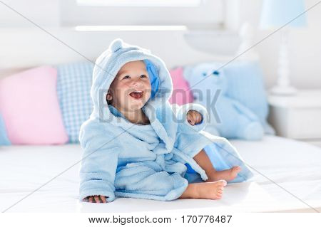 Baby In Bathrobe Or Towel After Bath