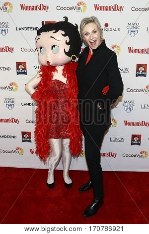 Actress Jane Lynch (R) and Betty Boop attend the 14th Annual Woman's Day Red Dress Awards at Jazz at Lincoln Center on February 7, 2017 in New York City.