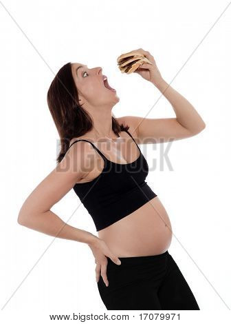 임신 백인 여자 먹는 햄버거 탐욕 고립 된 스튜디오 흰색 바탕에