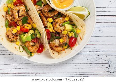 Shrimp Tacos with Corn and Avocado Salsa. Selective focus.