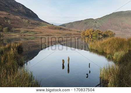 Beautiful Autumn Fall Landscape Image Of Crummock Water At Sunrise In Lake District England