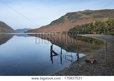 Beautiful Autumn Fall Landscape Image Of Crummock Water At Sunrise In Lake District England