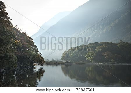 Beautiful Autumn Fall Landscape Image Of Crummock Water At Sunrise In Lake District England