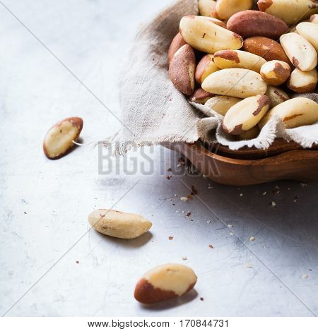 Still life, food and drink, heathy nutrition concept. Portion of organic healthy brazil nuts on a rustic table, selenium source