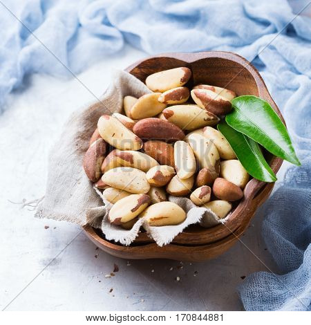 Still life, food and drink, heathy nutrition concept. Portion of organic healthy brazil nuts on a rustic table, selenium source