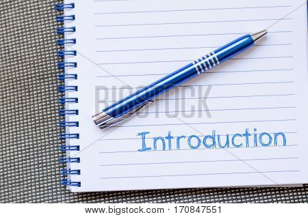 Introduction text concept write on notebook .
