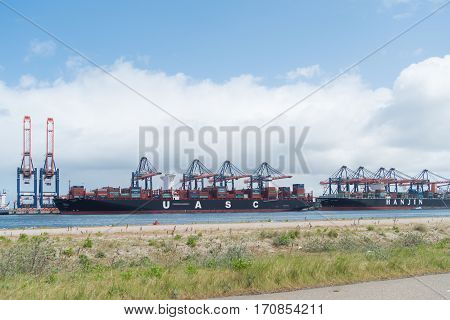 ROTTERDAM NETHERLANDS - MAY 14 2016: UASC Container ship being unloaded in the rotterdam port. United Arab Shipping Company owns and operates a fleet of 52 ships