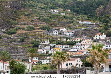 Fields and houses along west coast near Porto Moniz on Madeira Island. Portugal