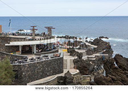 PORTO MONIZ, MADEIRA PORTUGAL - SEPTEMBER 5, 2016: Natural rock pool of Porto Moniz. It is a public bath with water from the Atlantic Ocean.