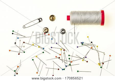 Background with a Multitude of Pins with the Head in Various Colors isolated in white