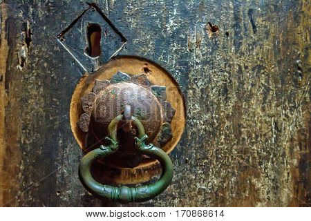 Antient door handle at gates of cave temple in Dambulla, Sri Lanka