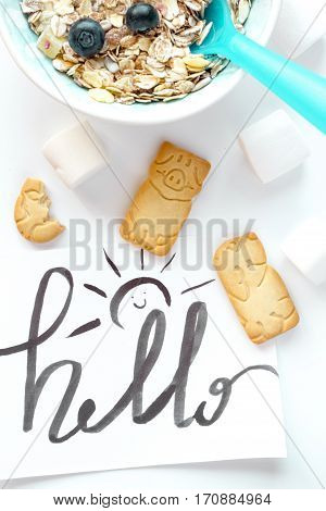 concept kid breakfast with muesli top view on white background.
