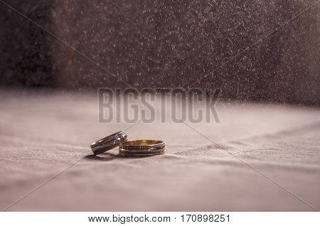 Wedding Love Concept. 2 Golden Wedding Rings On Textile Toned Background. Selective Focus