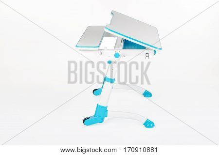 Blue school desk is isolated on a white background