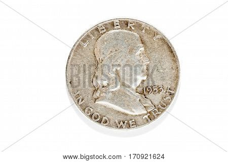 Old Dirty Coin Of The United States Made Of Silver. Photo Close-up On A White Background.