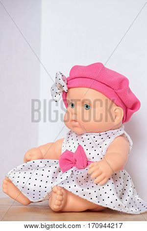 the doll with pink bow close to